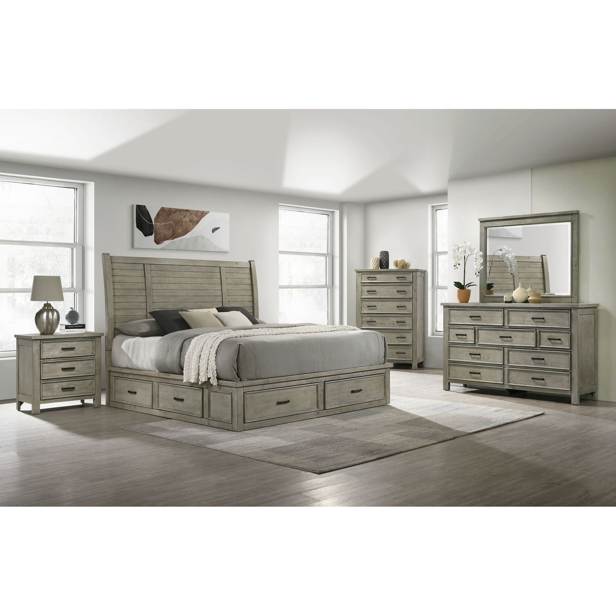Front-angle view showcasing the tall chest of drawers with its seven drawer fronts and distressed gray finish.