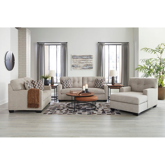Full living room scene showcasing the Ashley sofa, loveseat, and chaise lounge, highlighting the collection's contemporary style and light gray upholstery in a bright setting.