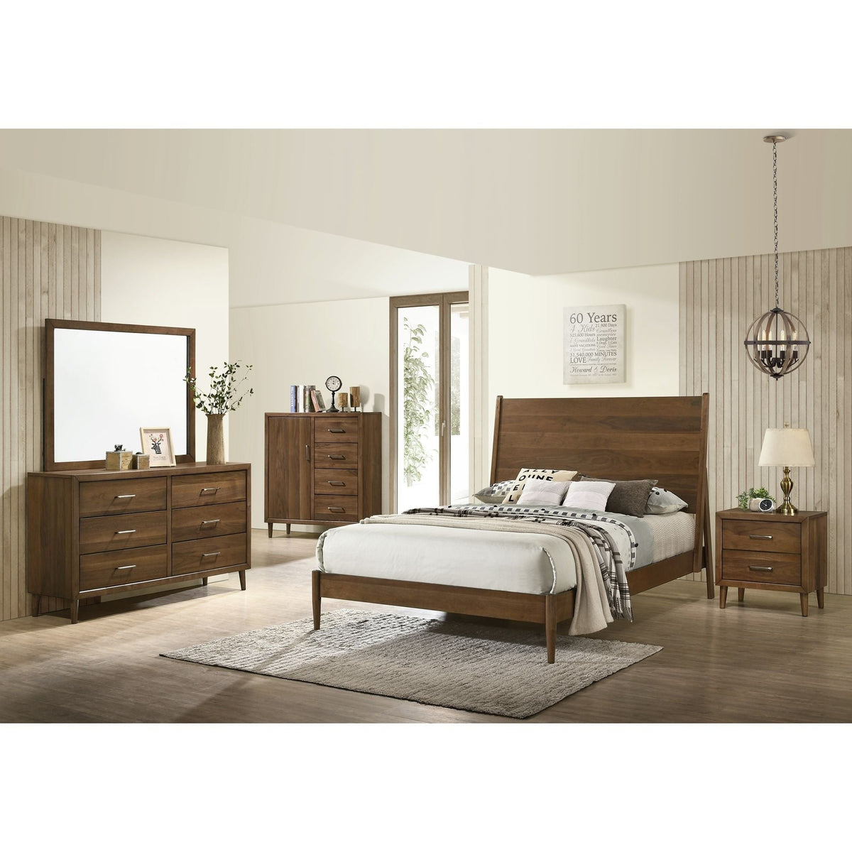 A clear, well-lit full front view of the Elements International 4-drawer chest, highlighting its storage configuration and tapered legs.