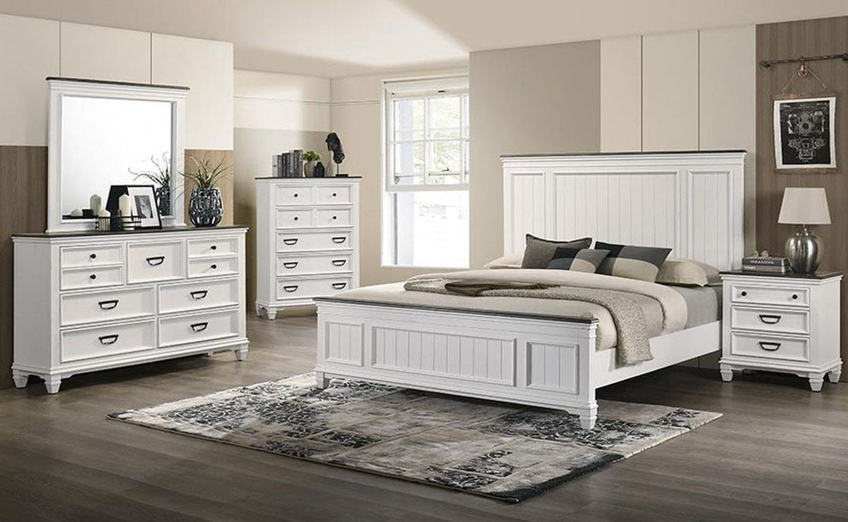 Full frontal view of the white dresser with a contrasting dark top and matching rectangular mirror, showcasing its seven drawers and decorative hardware.