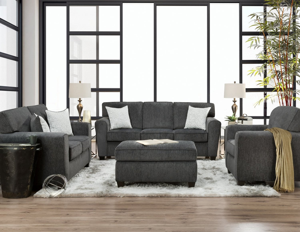 Main view of the sofa, accompanied by a matching loveseat and armchair, showcasing the contemporary design and Tofi Kohl fabric in a brightly lit, modern living room.