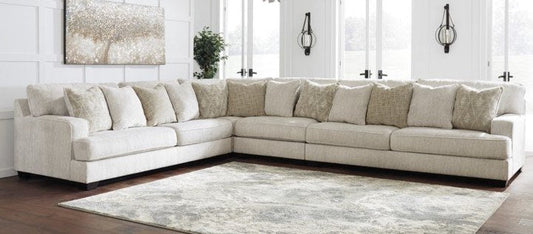 Ashley Rawcliffe Parchment three-piece sectional with left sofa, right sofa and corner wedge; no ottoman shown