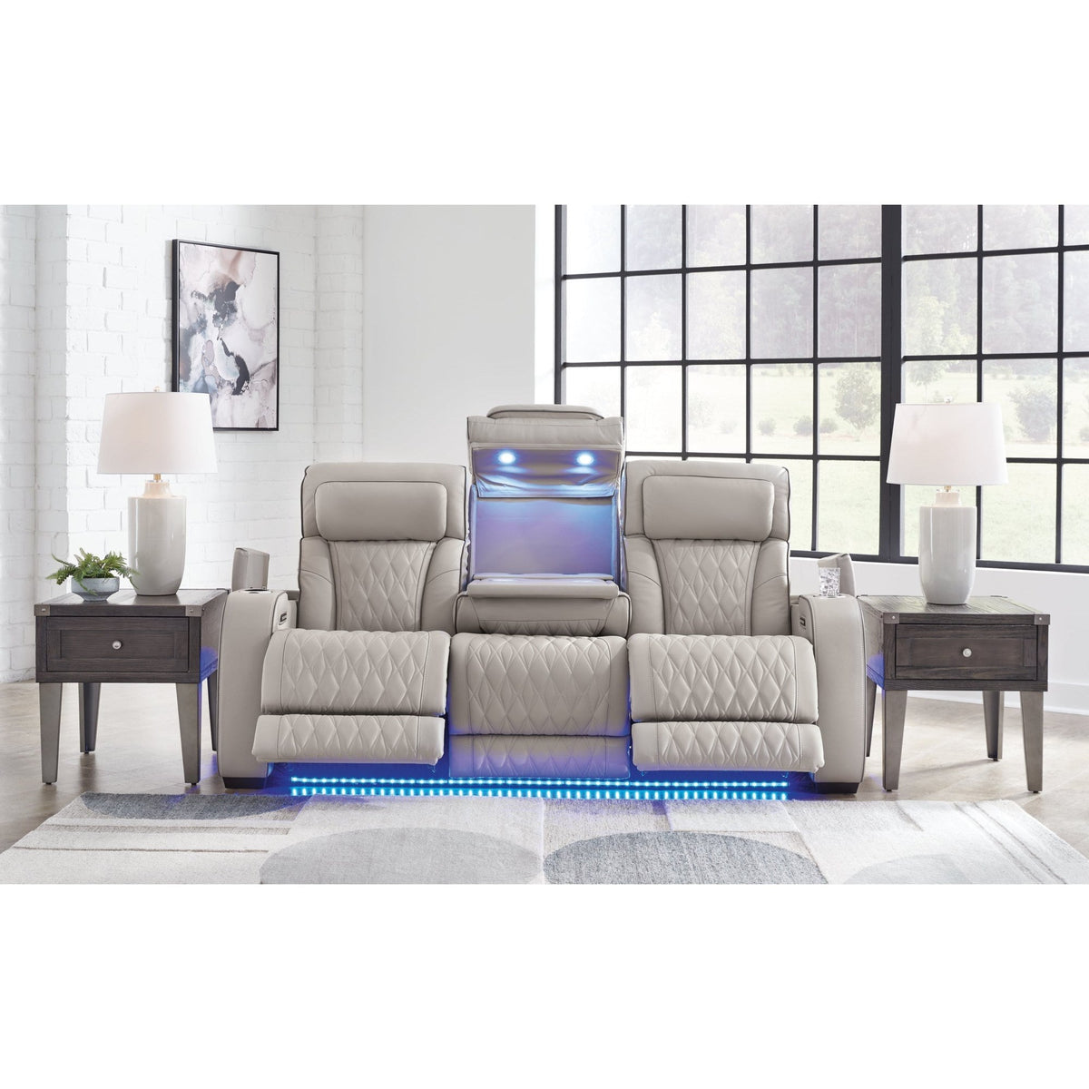 Ashley Boyington U2710518 gray leather-match power reclining loveseat with console in a room setting