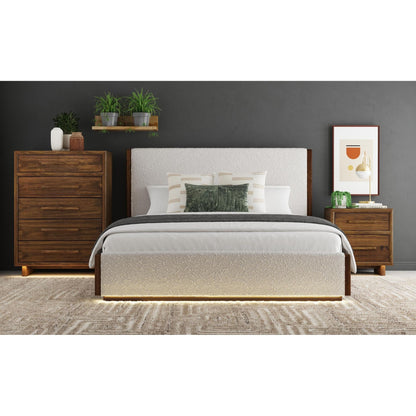 Full view of the modern king bed, showcasing its upholstered headboard, wooden frame, and ambient under-bed lighting, set within a sophisticated bedroom scene.