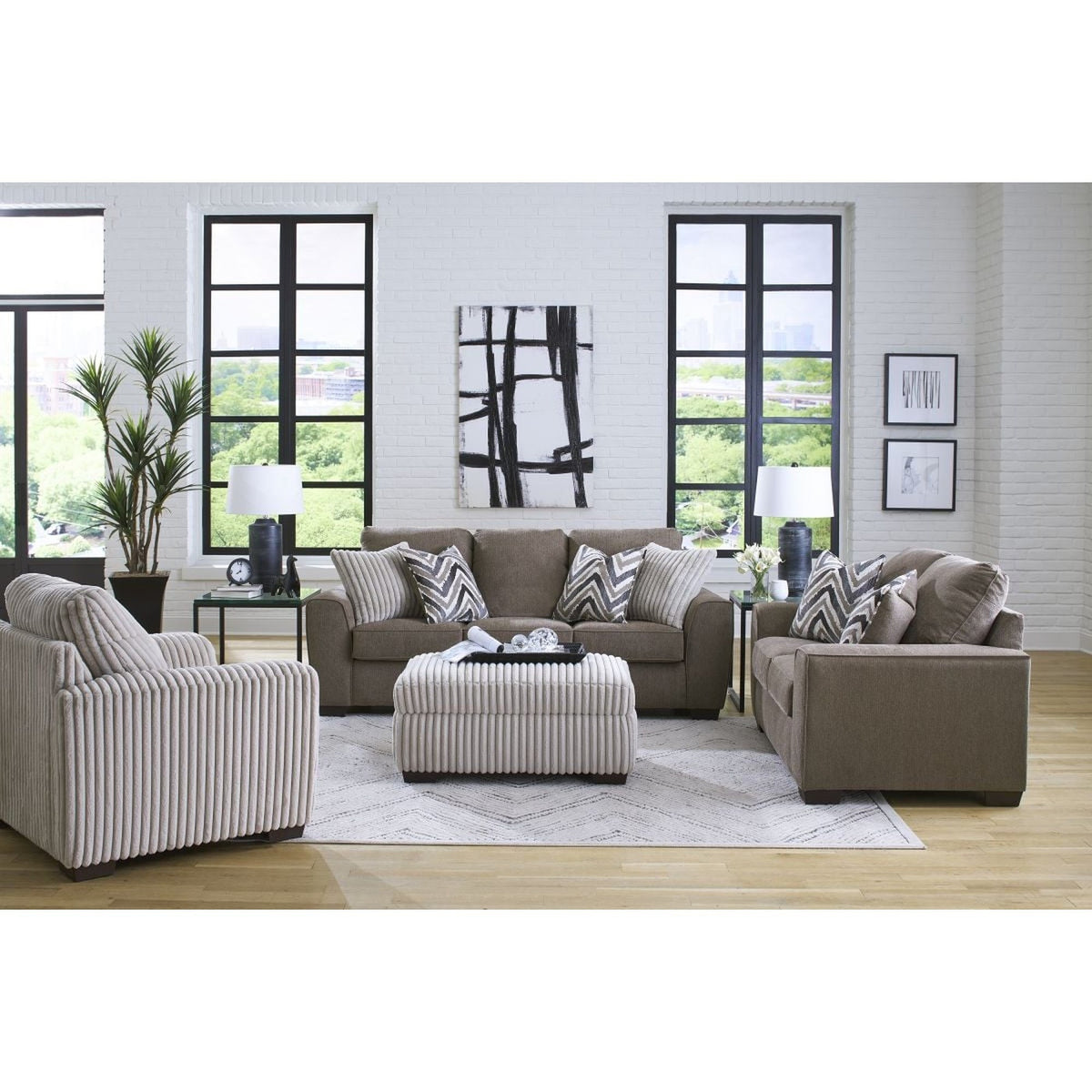 Full view of the contemporary Java brown sofa, loveseat, armchair, and ottoman set, showcasing the rich fabric and modern design in a bright living room.
