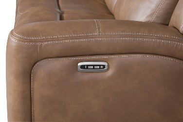 Close-up of the armrest on a reclining piece, highlighting the sleek, integrated metallic control panel for power reclining functionality.