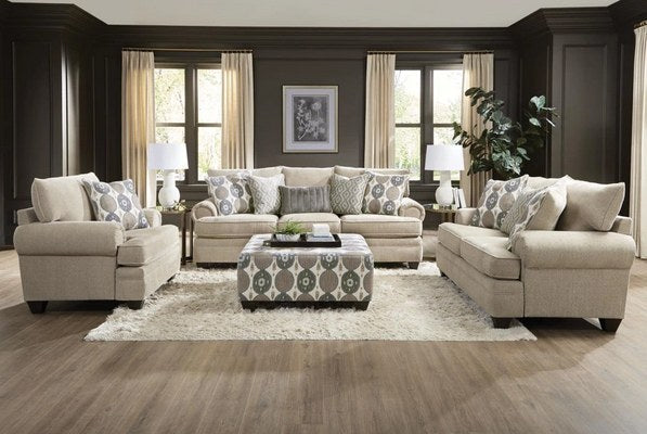 Clear, eye-level front view of the cocktail ottoman with the matching sofa, showcasing its patterned upholstery and decorative tray.