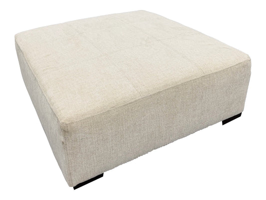 Behold Koda Cream storage ottoman, actual floor photograph isolated on white; ottoman only