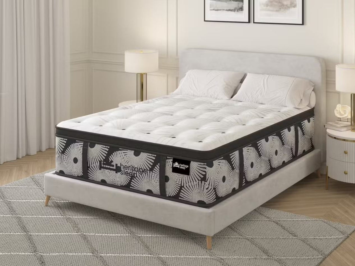 Bedroom scene with a Heritage Sleep-branded mattress; pictured model and size have not been verified