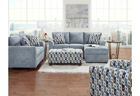 Frontal view highlighting the main sectional sofa and patterned ottoman.
